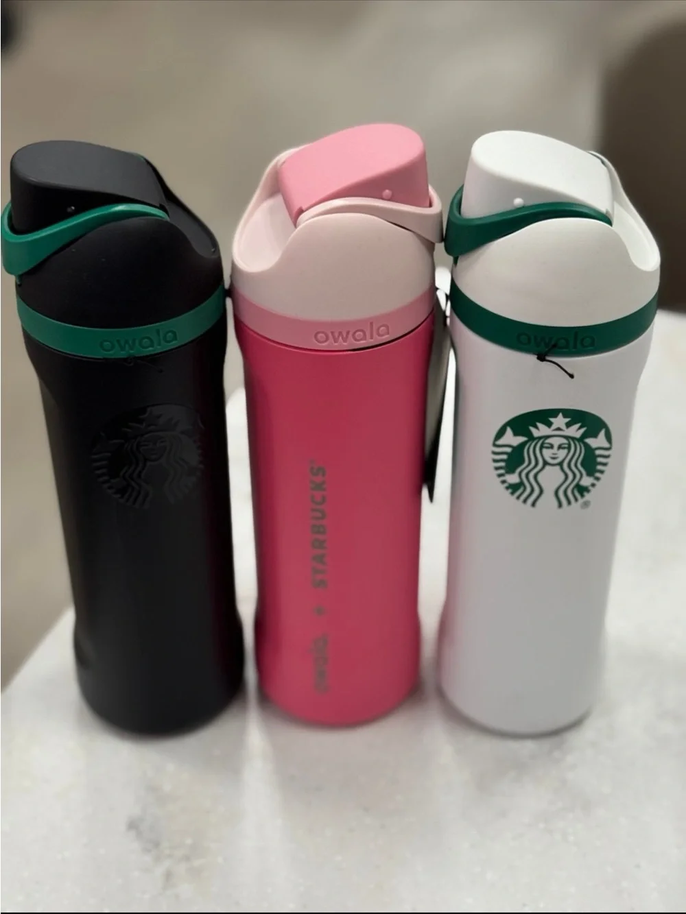 Starbucks x Owala pink white and black green stainless steel tumblers